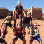 Class group playing at making a human tower in Hamman, Jordan